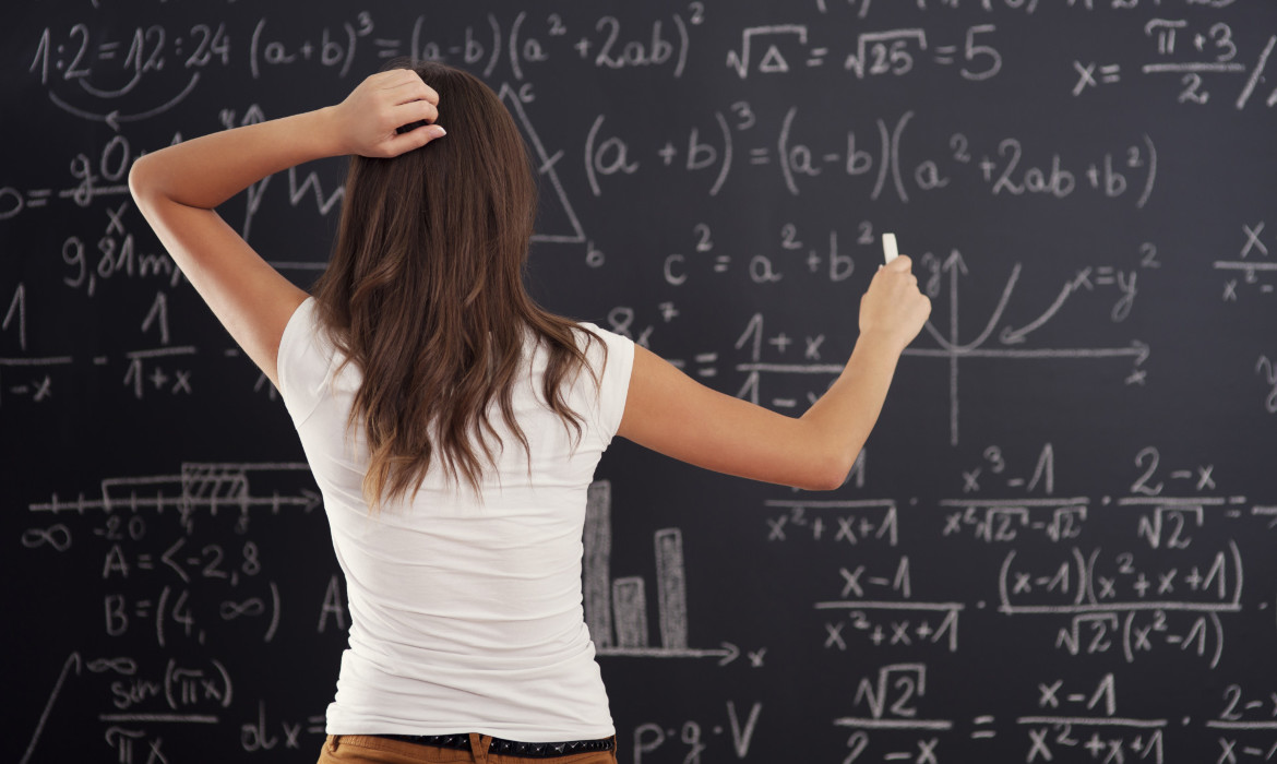6joxx3qa6b_____young-woman-looking-math-problem-blackboard